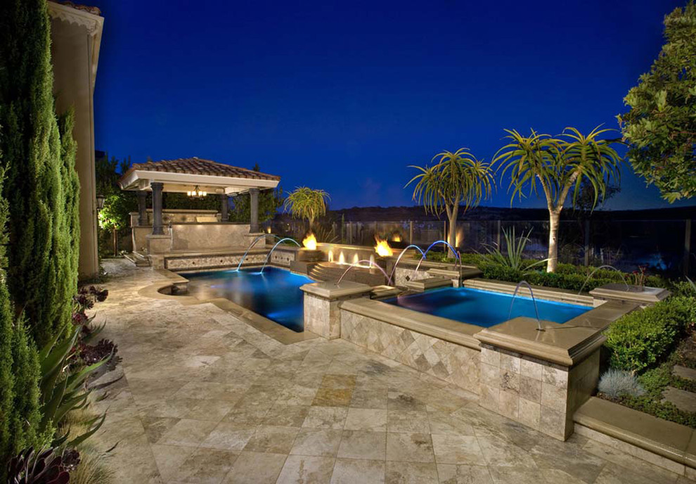 Photo of a mid-sized mediterranean side yard rectangular pool in Orange County.