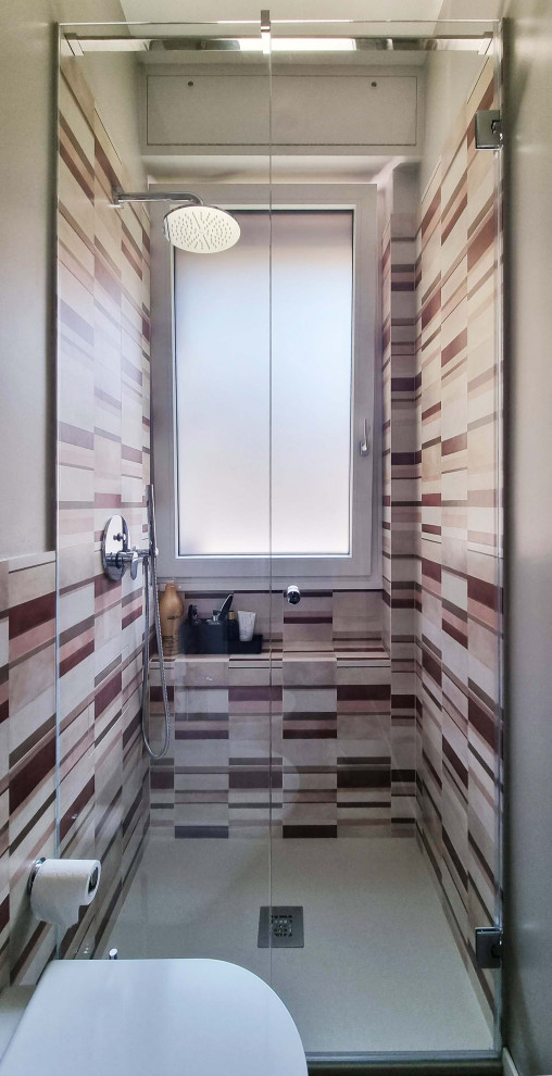 Photo of a small contemporary shower room bathroom in Milan with flat-panel cabinets, white cabinets, an alcove shower, a two-piece toilet, porcelain tiles, beige walls, porcelain flooring, a vessel sink, solid surface worktops, grey floors, a hinged door, white worktops, a single sink and a floating vanity unit.