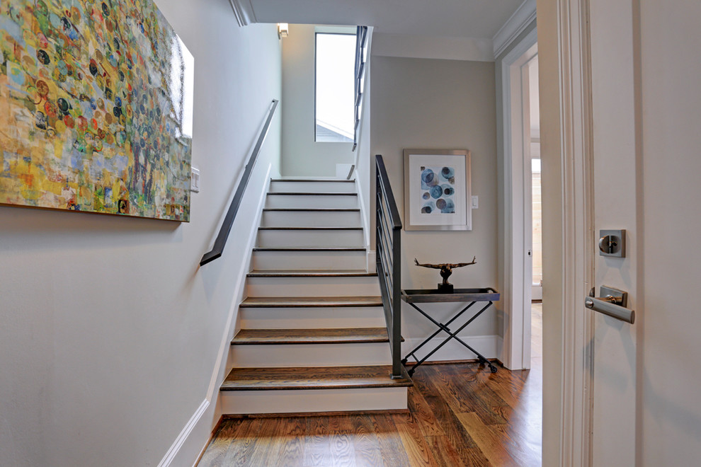 Inspiration for a large transitional wooden straight staircase remodel in Houston with wooden risers