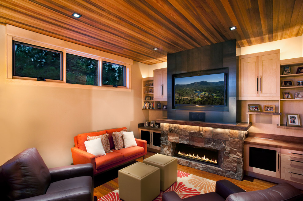 Inspiration for a contemporary family room in Sacramento with a stone fireplace surround.