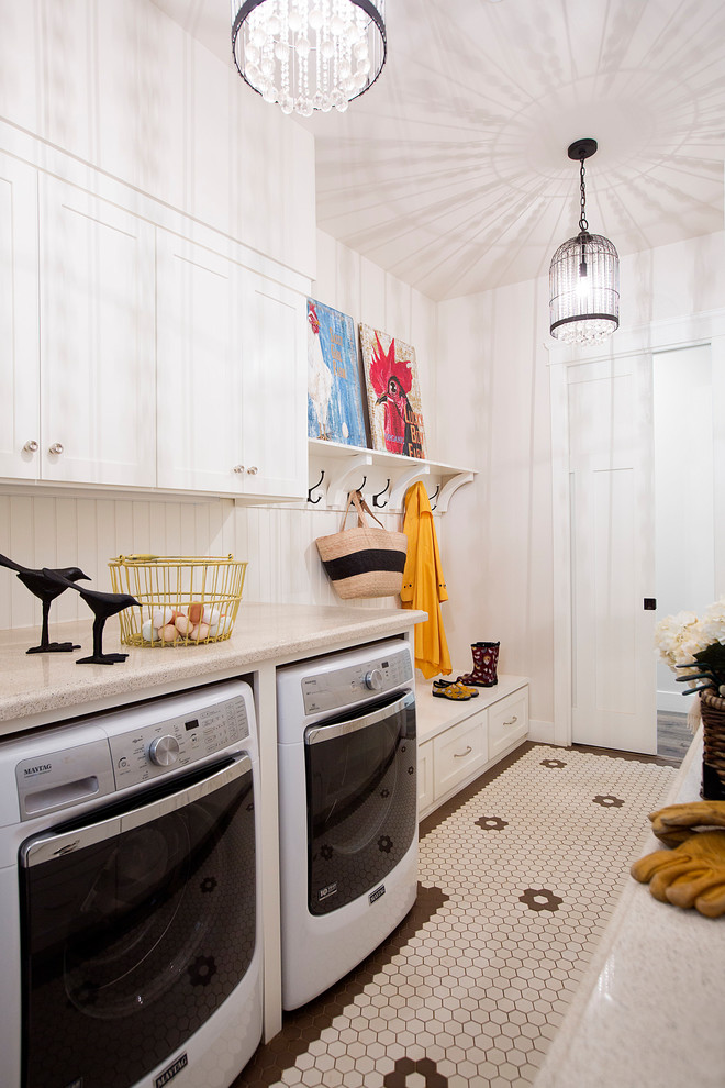 Photo of a country galley utility room in Sacramento with shaker cabinets, white cabinets, white walls, painted wood floors, a side-by-side washer and dryer, multi-coloured floor and beige benchtop.