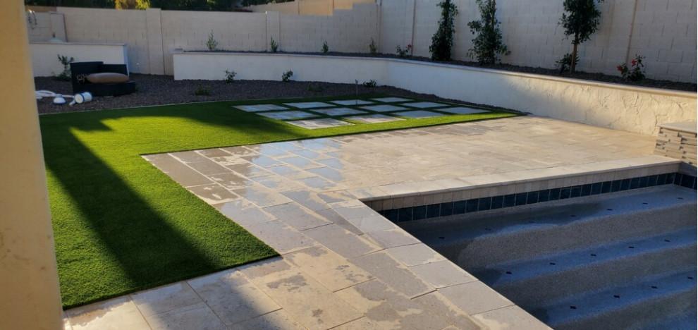 Inspiration for a contemporary backyard brick lawn edging.