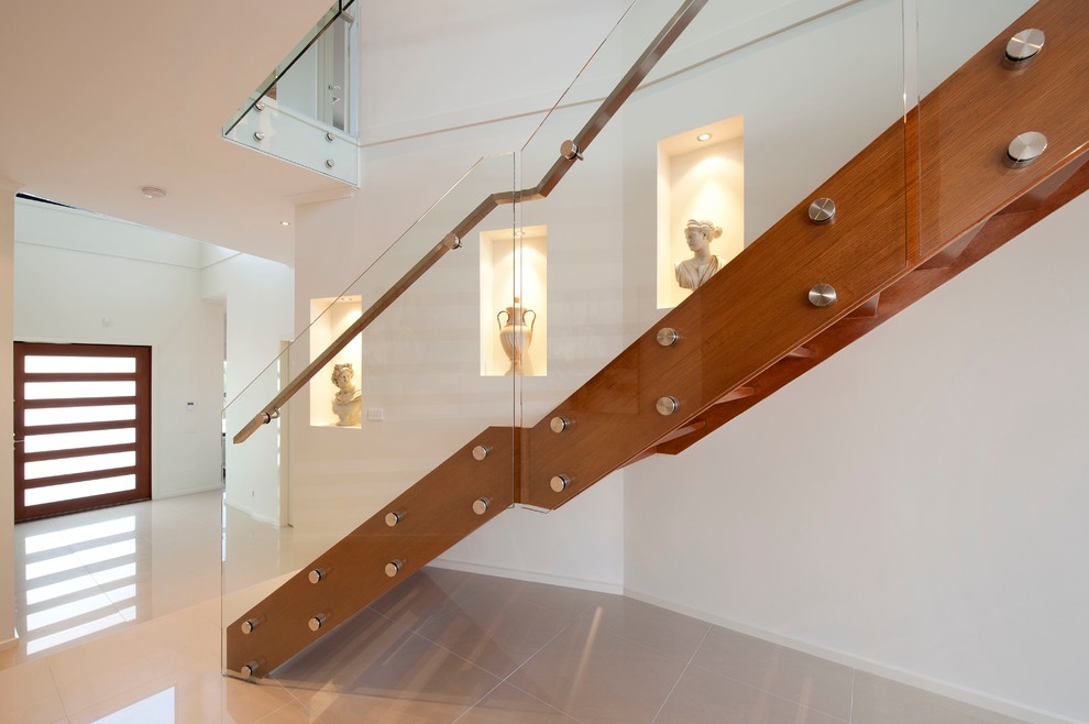 Design ideas for a contemporary wood staircase in Melbourne with open risers.