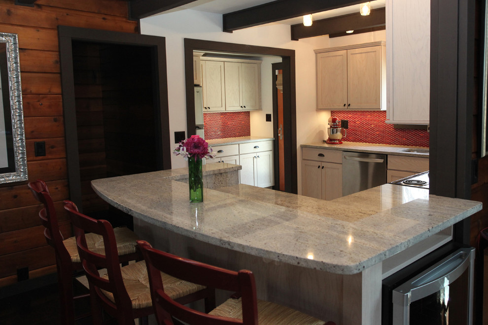 Example of a transitional ceramic tile kitchen design in New York with an undermount sink, shaker cabinets, light wood cabinets, granite countertops, red backsplash, ceramic backsplash and stainless steel appliances
