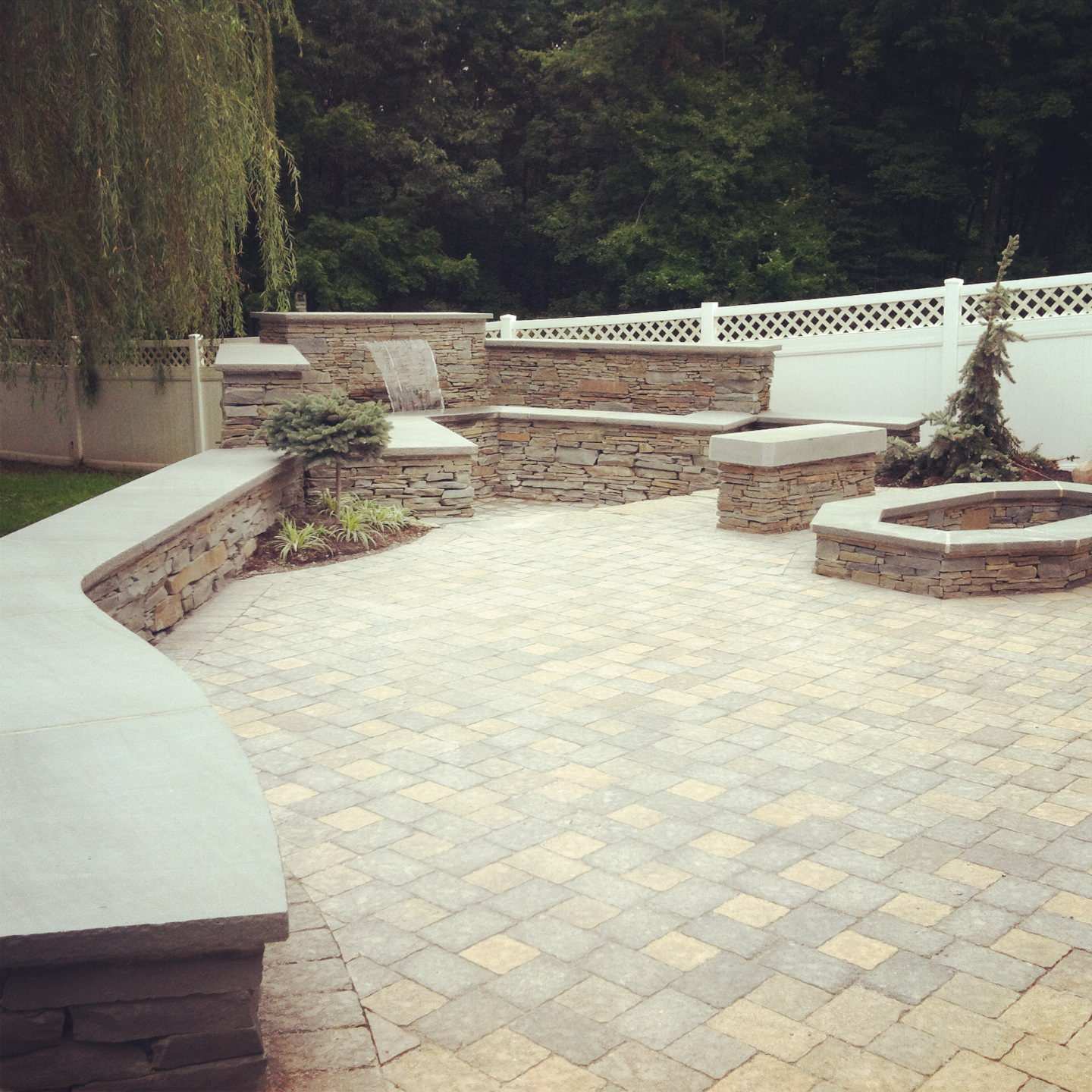 paver patio with waterwall bluestone walls and unique bluestone firepit