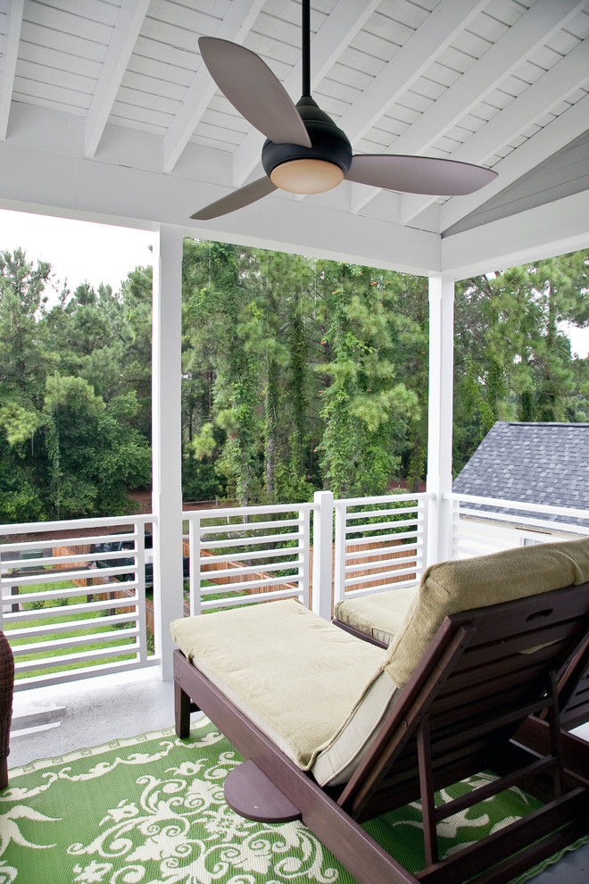 Inspiration for a beach style balcony in Charleston with a roof extension.