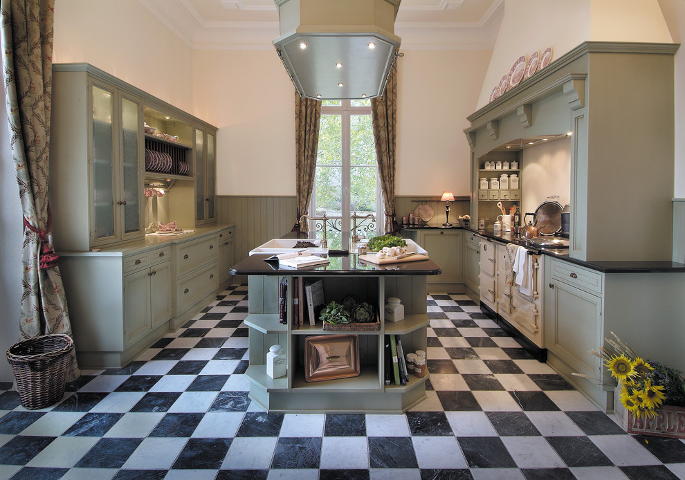 Large country galley separate kitchen in Dusseldorf with a farmhouse sink, marble floors, white splashback, with island, shaker cabinets, multi-coloured floor and white appliances.