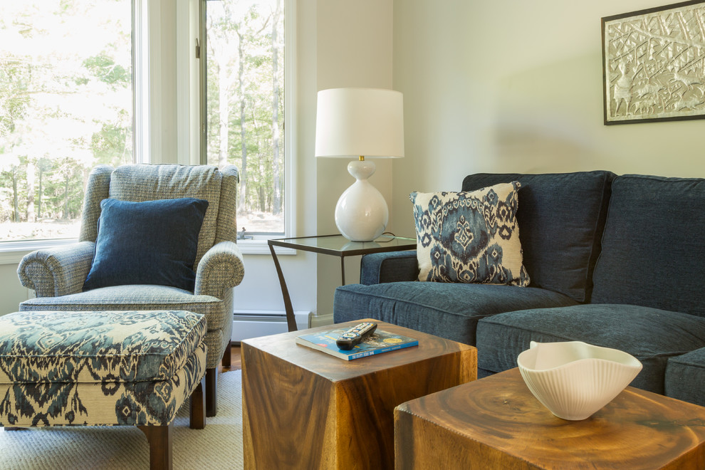 Photo of a mid-sized contemporary open concept family room in Salt Lake City with a library, medium hardwood floors, brown floor, grey walls and a wall-mounted tv.