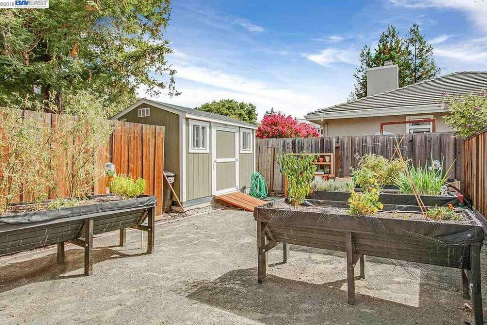 Design ideas for a large full sun backyard decomposed granite vegetable garden landscape in San Francisco.