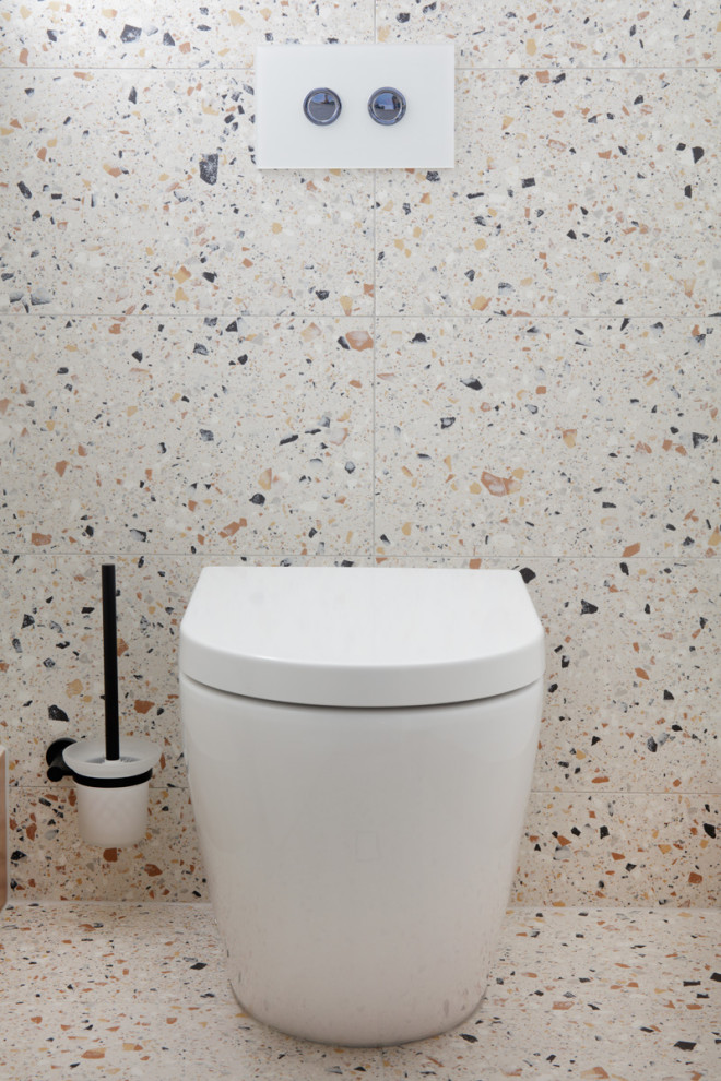 Cette photo montre une petite salle de bain méditerranéenne avec un placard en trompe-l'oeil, des portes de placard blanches, WC séparés, un carrelage multicolore, des carreaux de porcelaine, un mur multicolore, un sol en carrelage de porcelaine, une vasque, un plan de toilette en quartz modifié, un sol multicolore, un plan de toilette blanc, meuble simple vasque et meuble-lavabo sur pied.