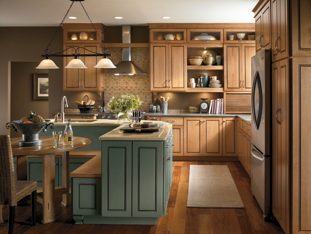 Mid-sized eclectic l-shaped medium tone wood floor eat-in kitchen photo in Grand Rapids with an undermount sink, quartz countertops, beige backsplash, ceramic backsplash, stainless steel appliances, an island, light wood cabinets and recessed-panel cabinets