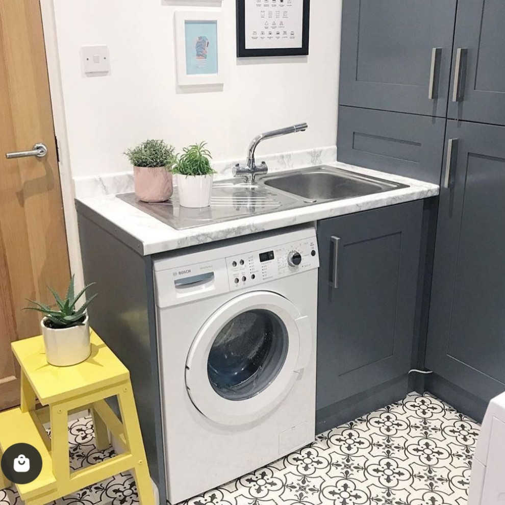 This is an example of a modern laundry room in Cheshire with vinyl floors and multi-coloured floor.