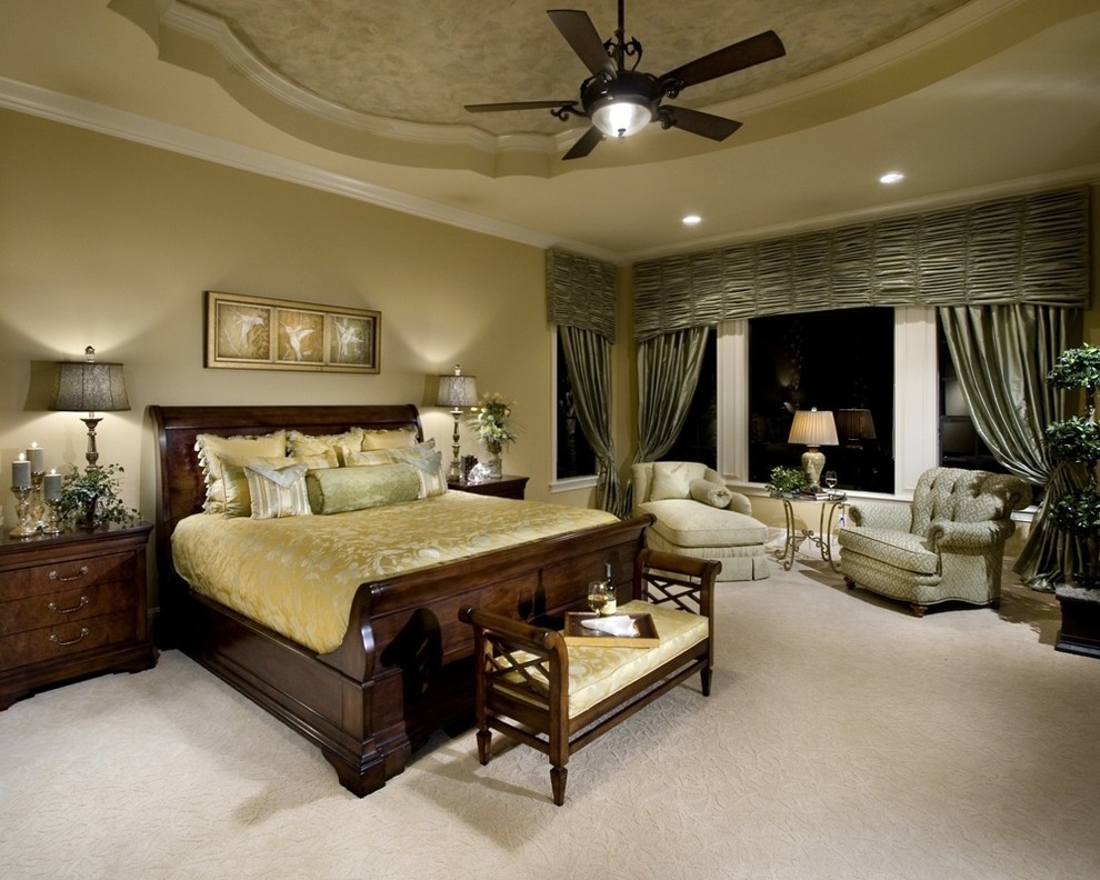 Photo of a large mediterranean master bedroom in Orlando with green walls and carpet.