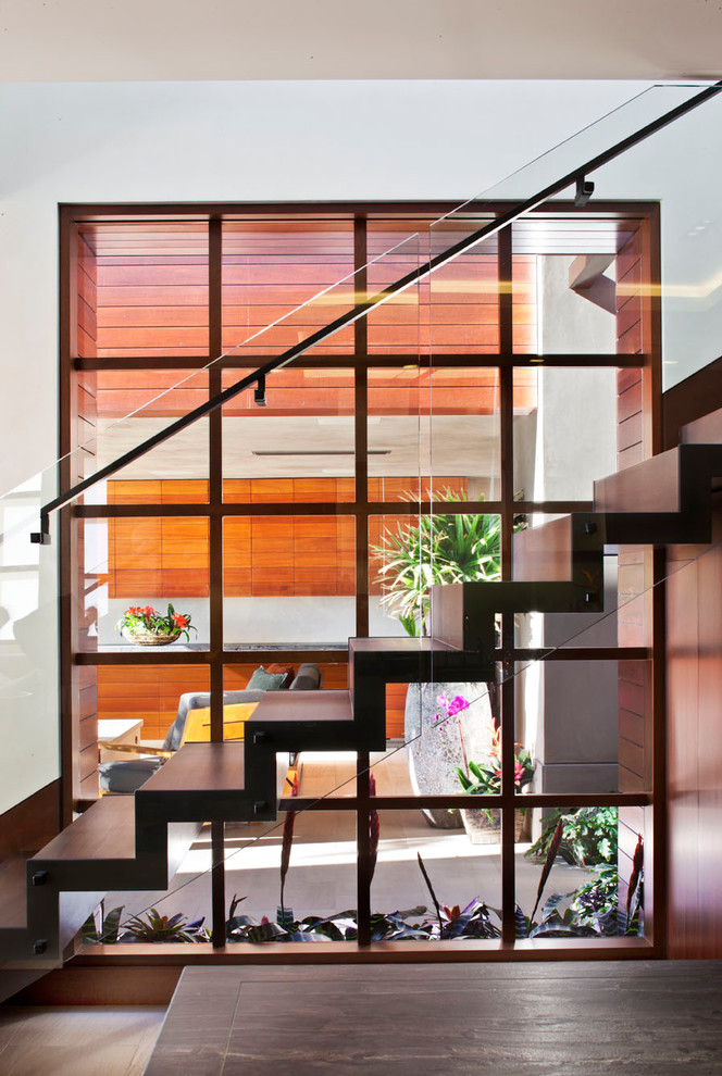 Design ideas for a large contemporary wood straight staircase in Los Angeles with wood risers.