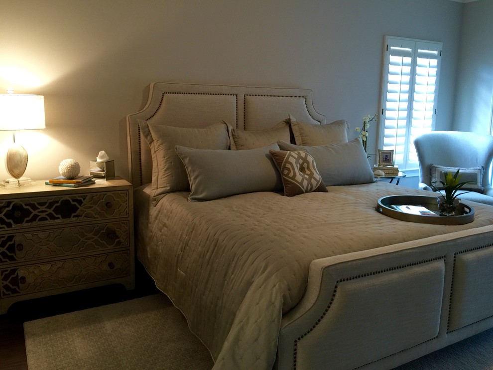 Photo of a beach style master bedroom in Orlando with white walls, dark hardwood floors and no fireplace.