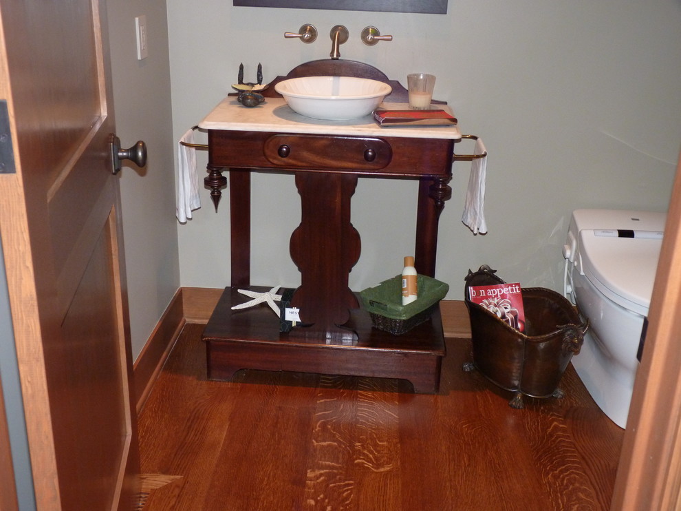 Powder room - eclectic powder room idea in Seattle with a vessel sink and marble countertops