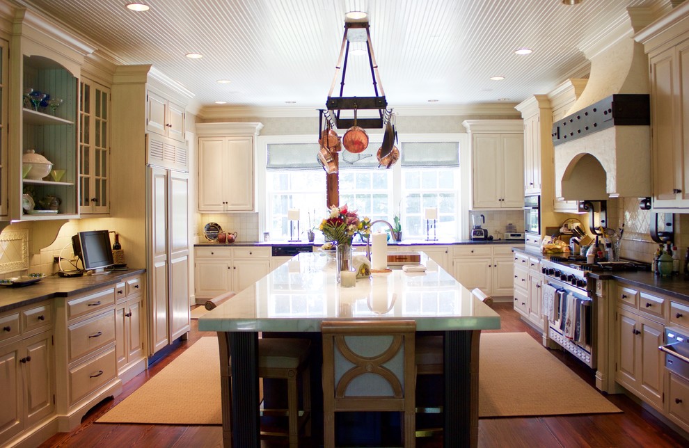 Inspiration for a large transitional dark wood floor eat-in kitchen remodel in DC Metro with marble countertops, an island, white cabinets, white backsplash and stainless steel appliances