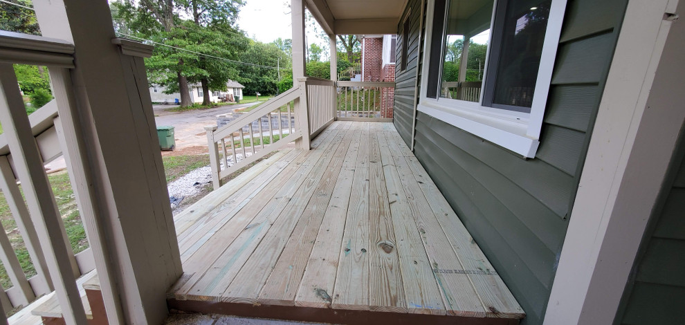 This is an example of a large modern side yard deck in Atlanta.