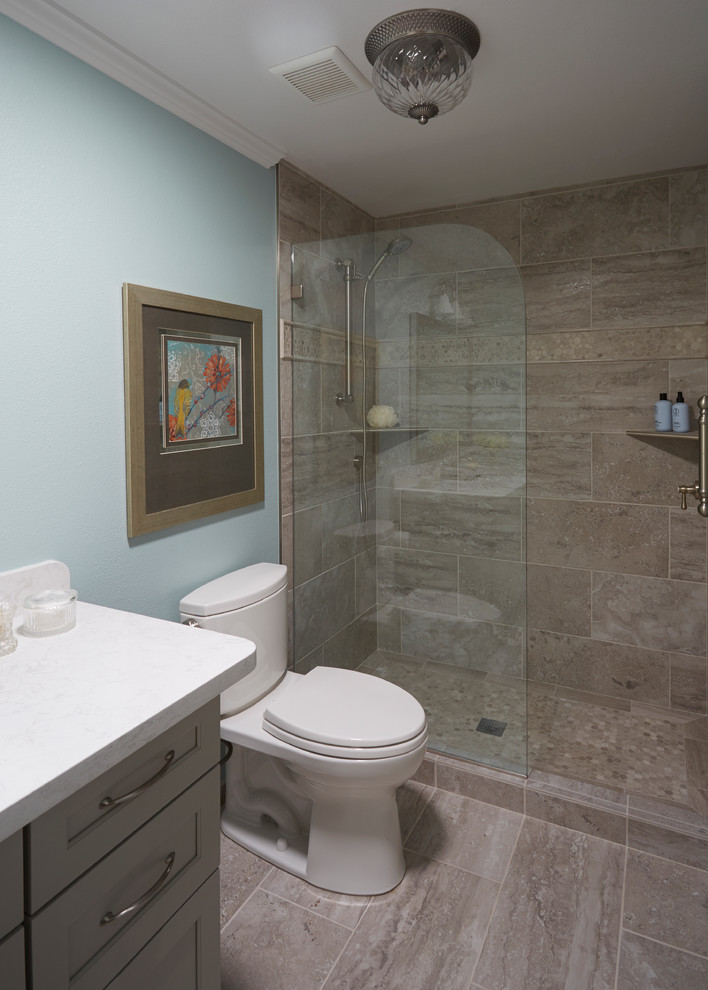 Design ideas for a mid-sized traditional bathroom in San Francisco with recessed-panel cabinets, grey cabinets, an open shower, a two-piece toilet, gray tile, porcelain tile, blue walls, an undermount sink and solid surface benchtops.