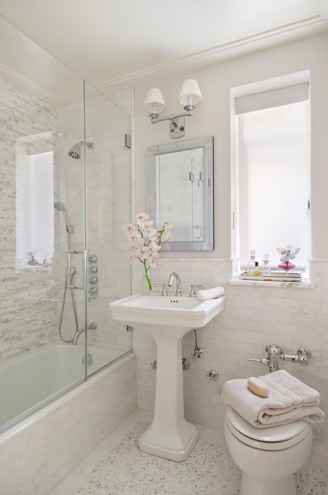 Small traditional master bathroom in Miami with a pedestal sink, an alcove tub, a shower/bathtub combo, white tile, white walls and marble floors.