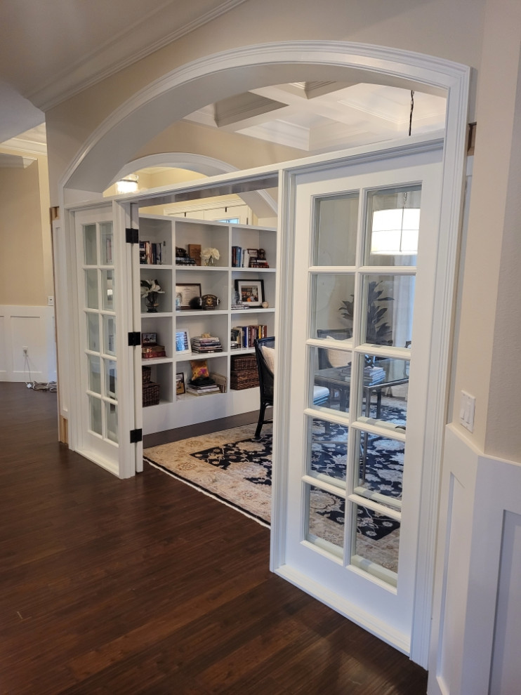 Large home office in Tampa with dark hardwood floors.