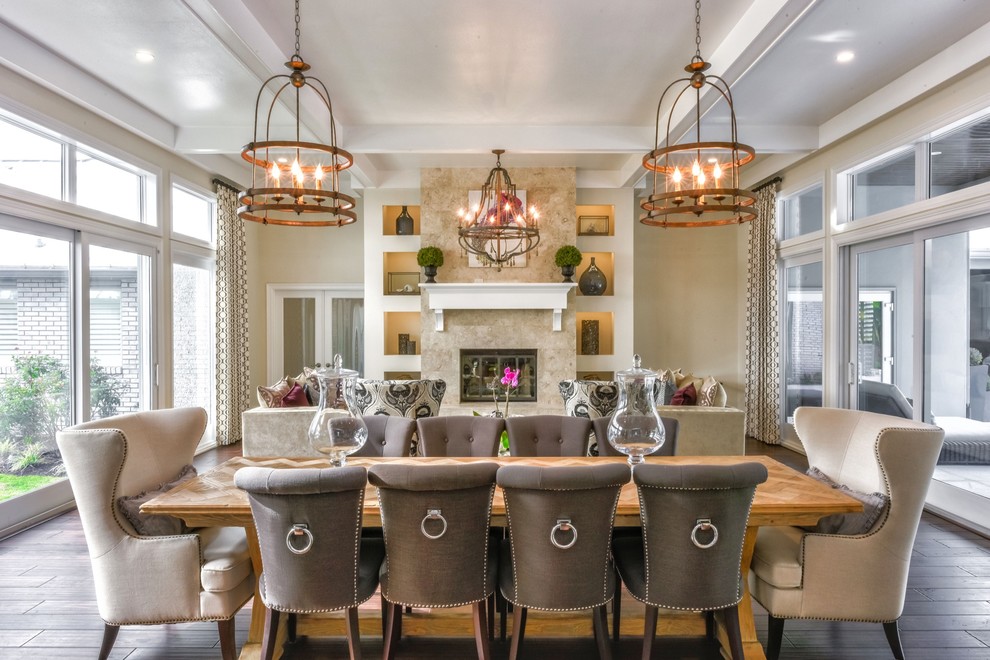 Design ideas for a large transitional open plan dining in Tampa with beige walls, dark hardwood floors, a standard fireplace, a stone fireplace surround and brown floor.
