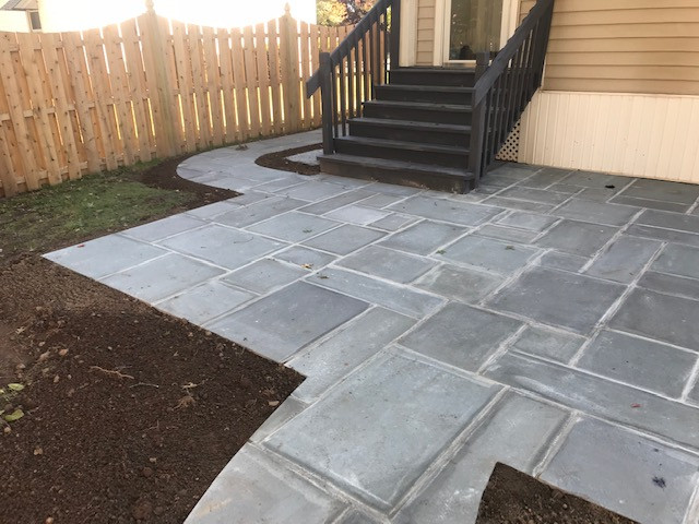 Bluestone patio wet lay with walkway and landscape