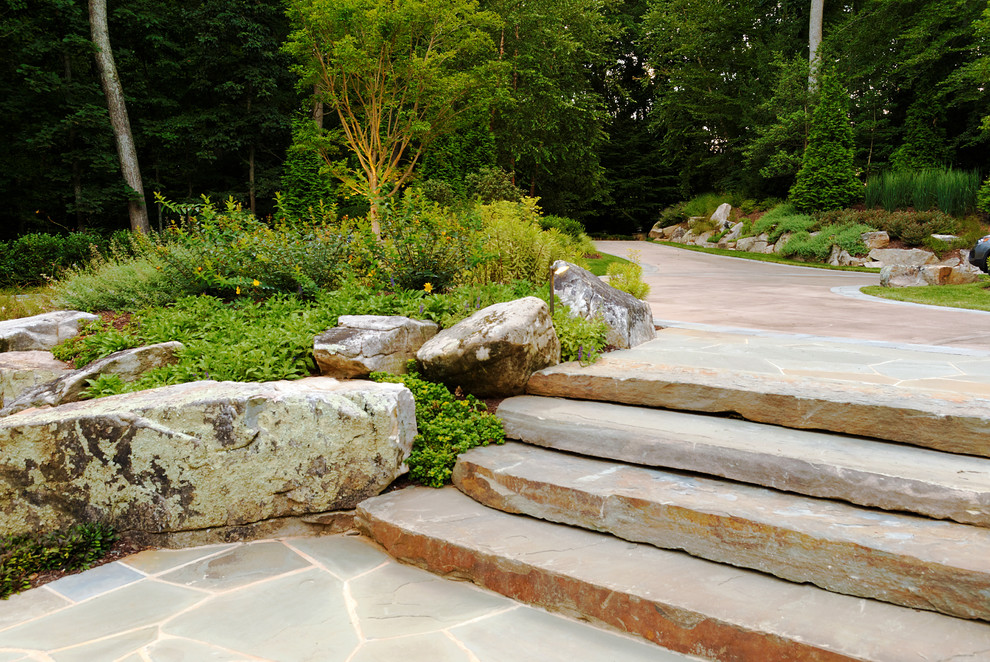 Transitional sloped garden in DC Metro with natural stone pavers.