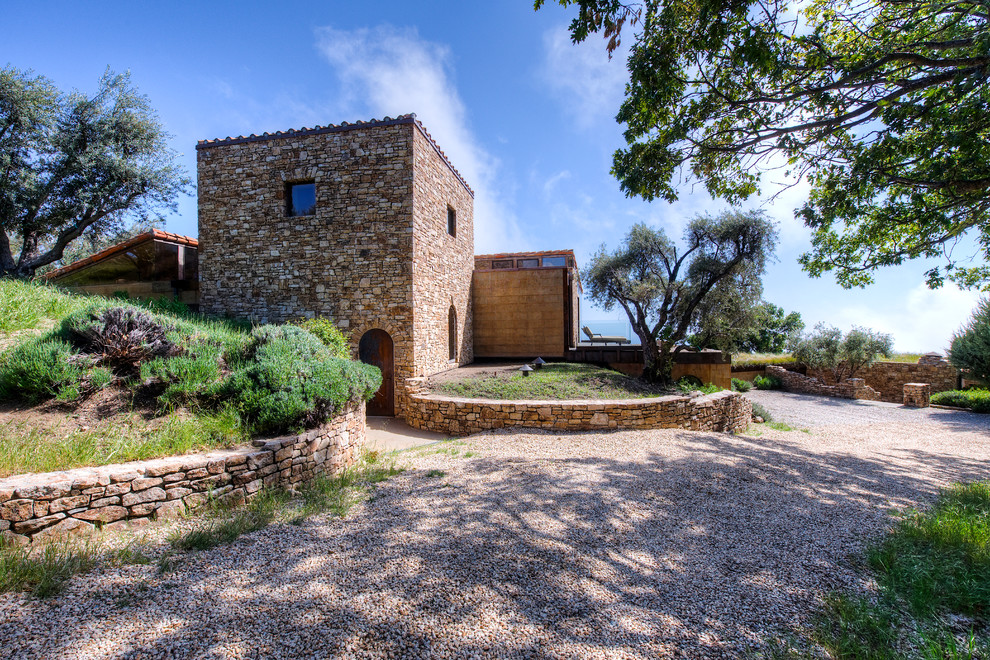 Big Sur Coast Ridge Estate - Breathtaking views of the incomparable Big Sur Coast, this classic Tuscan design of an Italian farmhouse, combined with a modern approach creates an ambiance of relaxed sophistication for this magnificent 95.73-acre, private coastal estate on California’s Coastal Ridge. Five-bedroom, 5.5-bath, 7,030 sq. ft. main house, and 864 sq. ft. caretaker house over 864 sq. ft. of garage and laundry facility. Commanding a ridge above the Pacific Ocean and Post Ranch Inn, this spectacular property has sweeping views of the California coastline and surrounding hills. “It’s as if a contemporary house were overlaid on a Tuscan farm-house ruin,” says decorator Craig Wright who created the interiors. The main residence was designed by renowned architect Mickey Muenning—the architect of Big Sur’s Post Ranch Inn, —who artfully combined the contemporary sensibility and the Tuscan vernacular, featuring vaulted ceilings, stained concrete floors, reclaimed Tuscan wood beams, antique Italian roof tiles and a stone tower. Beautifully designed for indoor/outdoor living; the grounds offer a plethora of comfortable and inviting places to lounge and enjoy the stunning views. No expense was spared in the construction of this exquisite estate.