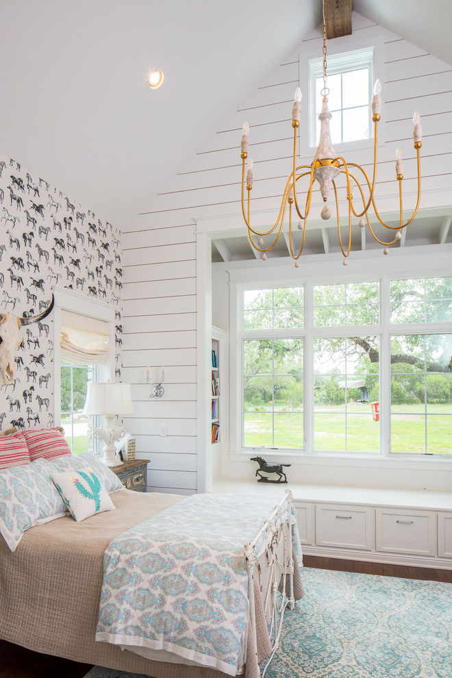 This is an example of a country kids' bedroom for girls in Austin with white walls.