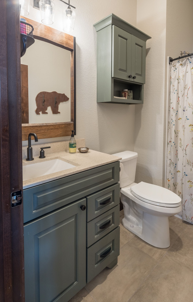 Design ideas for a large transitional bathroom in Minneapolis with raised-panel cabinets, green cabinets, linoleum floors and brown floor.