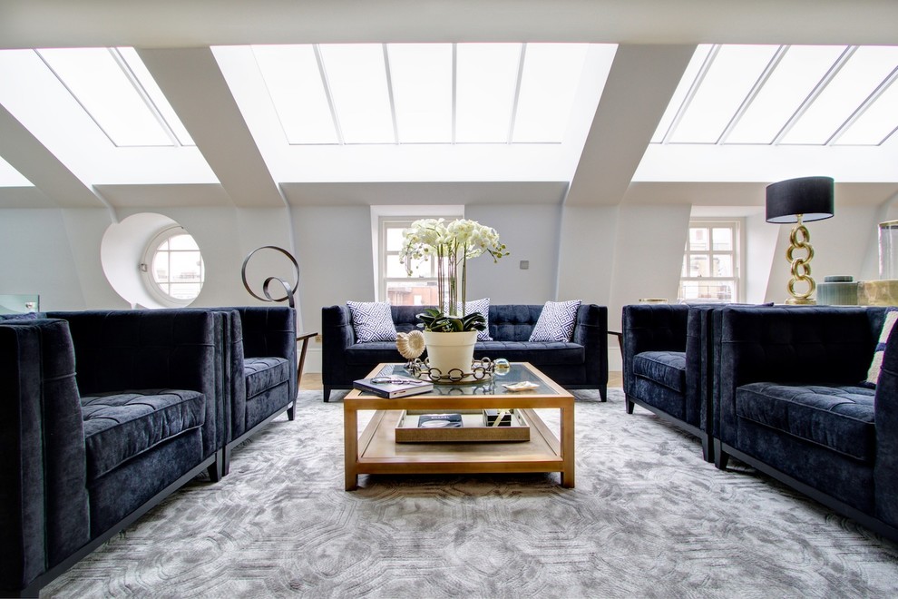 This is an example of a transitional sunroom in London with a glass ceiling.