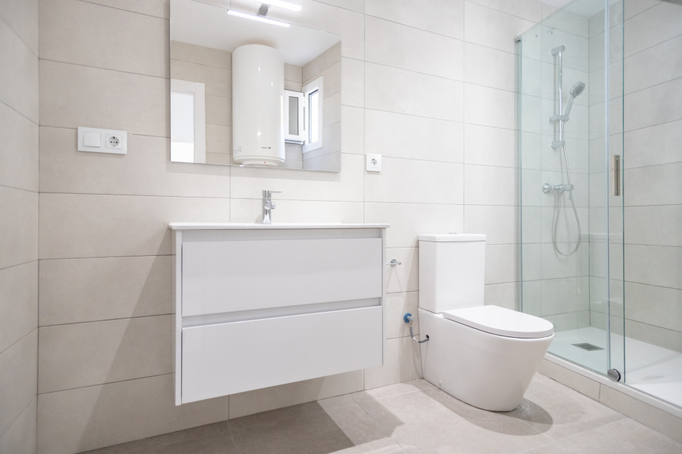Bathroom - mid-sized contemporary master beige tile and ceramic tile ceramic tile, beige floor and single-sink bathroom idea in Barcelona with flat-panel cabinets, white cabinets, a one-piece toilet, a trough sink, white countertops and a floating vanity