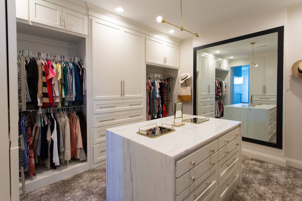 This is an example of a large beach style storage and wardrobe in Kansas City with carpet.