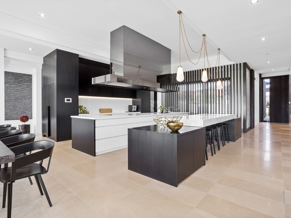 Design ideas for a contemporary galley eat-in kitchen in Perth with flat-panel cabinets, black cabinets, white splashback, multiple islands and beige floor.