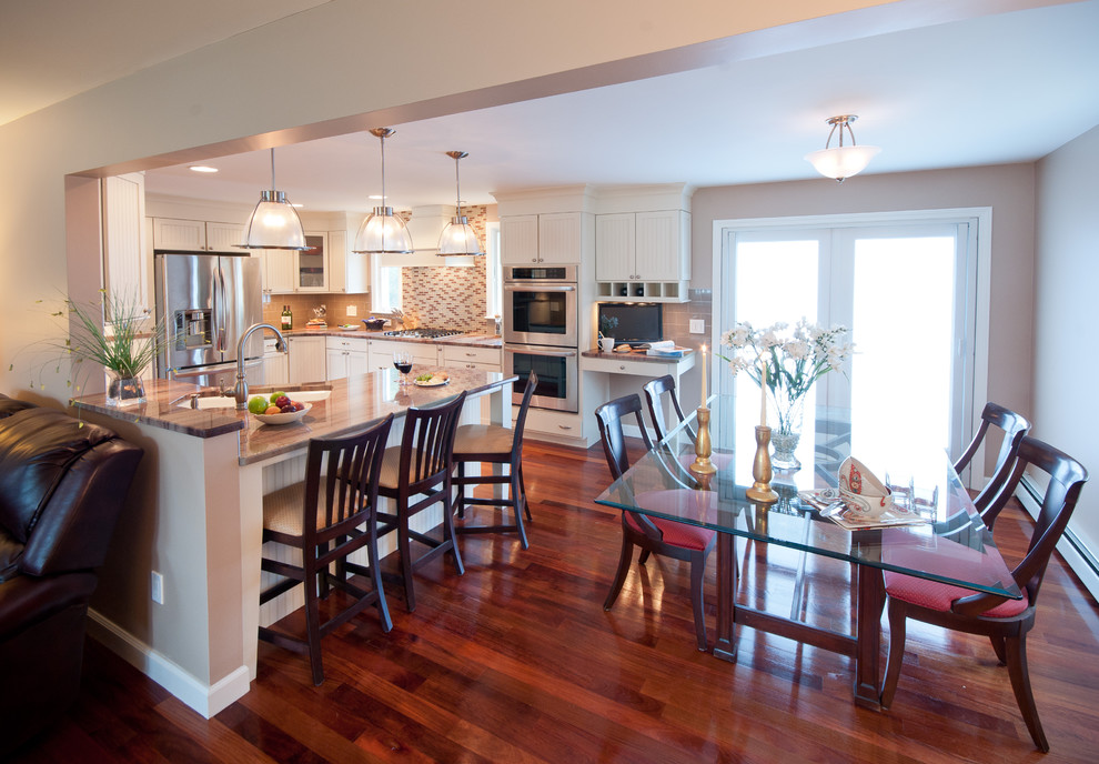 Mid-sized elegant u-shaped dark wood floor eat-in kitchen photo in Providence with an undermount sink, shaker cabinets, white cabinets, granite countertops, multicolored backsplash, mosaic tile backsplash, stainless steel appliances and a peninsula