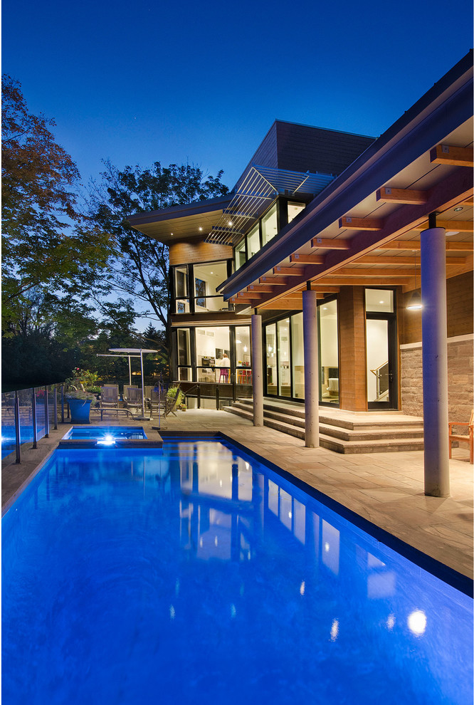 Inspiration for a contemporary rectangular pool in Toronto with a hot tub.