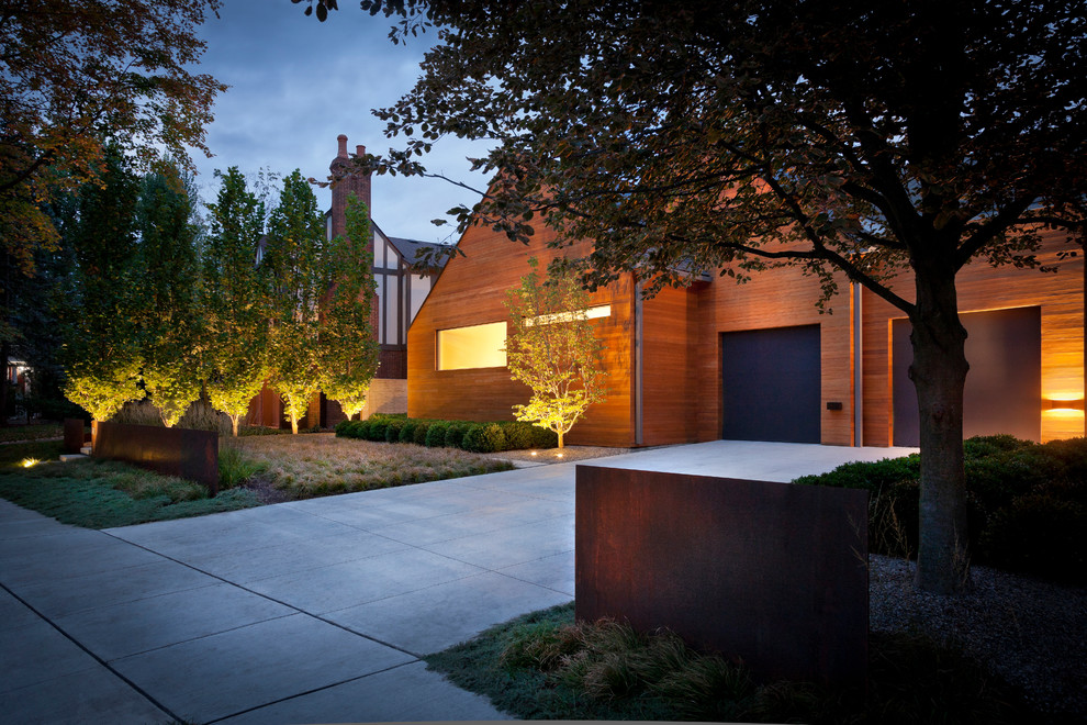 Mid-sized contemporary front yard driveway in Detroit with a garden path and concrete pavers.