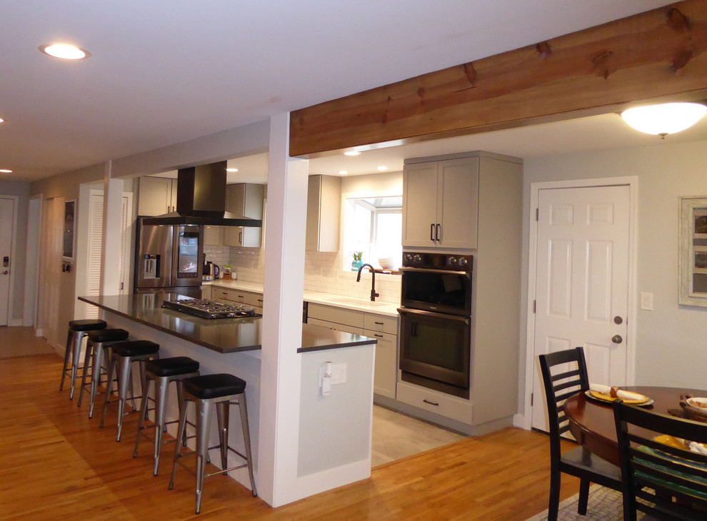 Example of a transitional kitchen design in Seattle