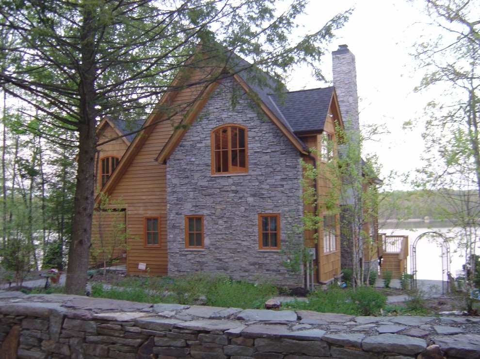 Inspiration for a large timeless brown two-story mixed siding exterior home remodel in New York with a shingle roof