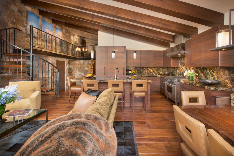 Example of a mountain style l-shaped dark wood floor and brown floor kitchen design in Denver with an undermount sink, flat-panel cabinets, dark wood cabinets, stainless steel appliances, an island and brown countertops