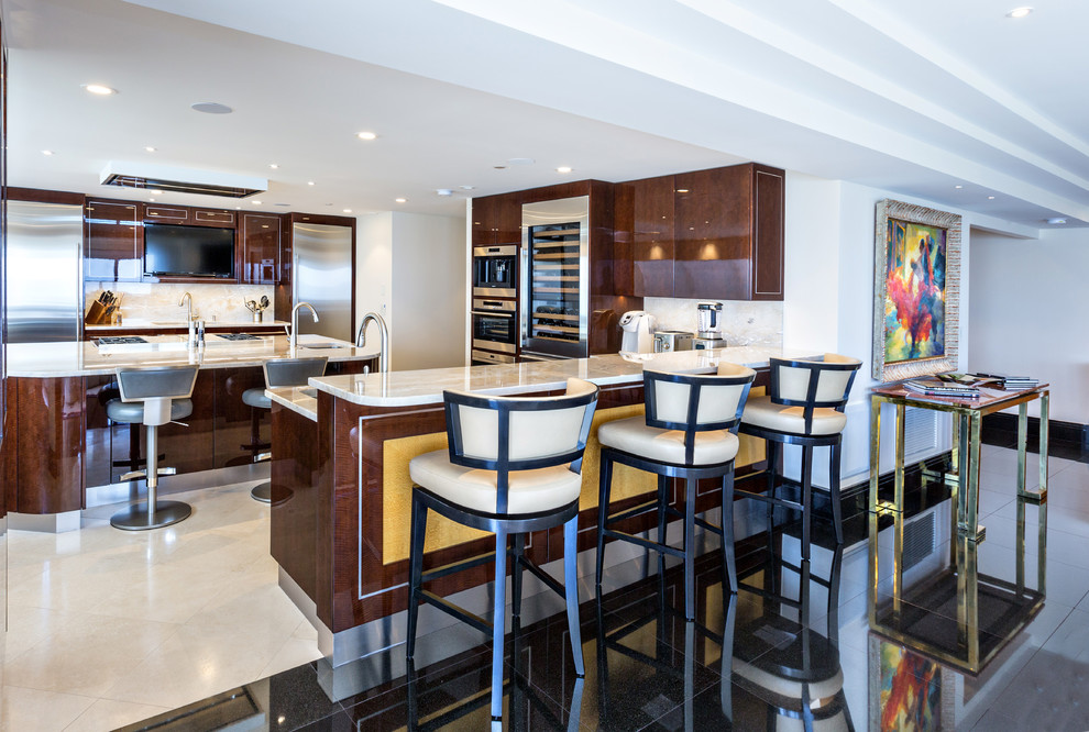 This is an example of a contemporary kitchen in Other with an undermount sink, flat-panel cabinets, brown cabinets, beige splashback, stainless steel appliances, beige floor and beige benchtop.