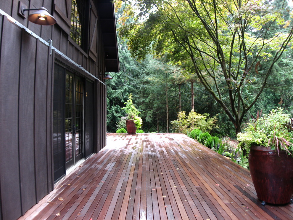 Photo of a mid-sized contemporary backyard patio in Seattle with a container garden, decking and no cover.