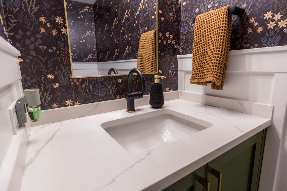 Inspiration for a small traditional cloakroom in Chicago with shaker cabinets, green cabinets, black walls, a submerged sink, engineered stone worktops, white worktops, a built in vanity unit and wallpapered walls.