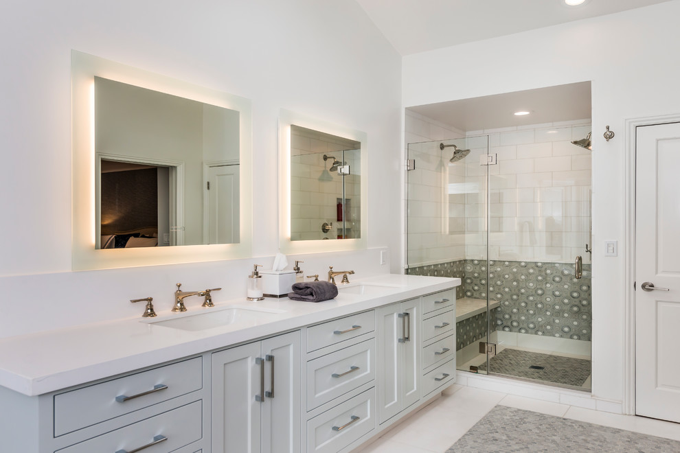 Design ideas for a large transitional master bathroom in San Francisco with shaker cabinets, white cabinets, an alcove shower, white tile, subway tile, white walls, ceramic floors, an undermount sink, solid surface benchtops, a freestanding tub, white floor and a hinged shower door.