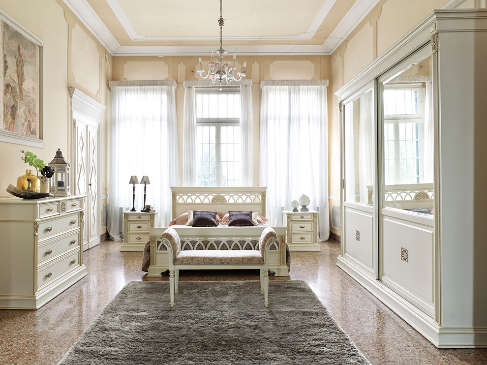 Design ideas for a traditional master bedroom in Venice with beige walls.