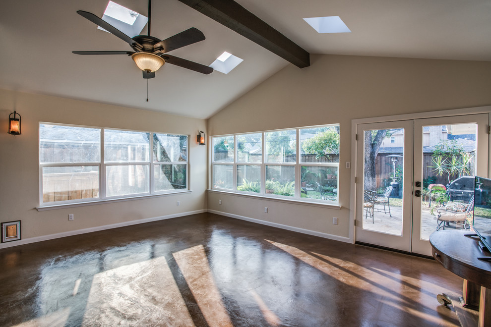 This is an example of a mid-sized traditional sunroom in Dallas with concrete floors, no fireplace, a skylight and brown floor.