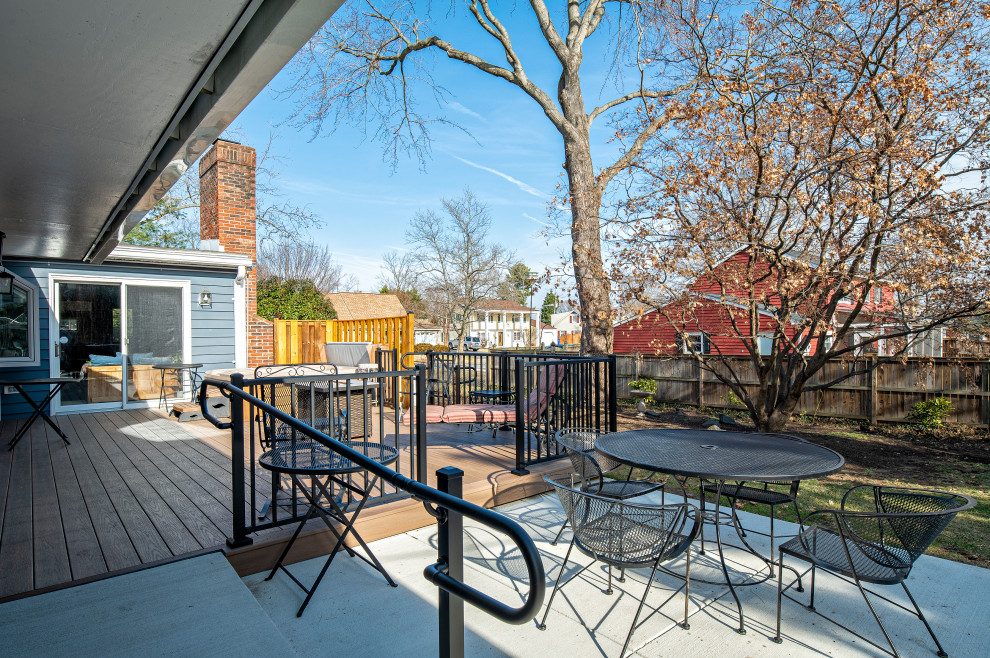 Large backyard ground level metal railing deck photo in DC Metro