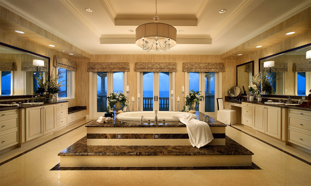 Inspiration for a mediterranean bathroom in Miami with a drop-in tub.