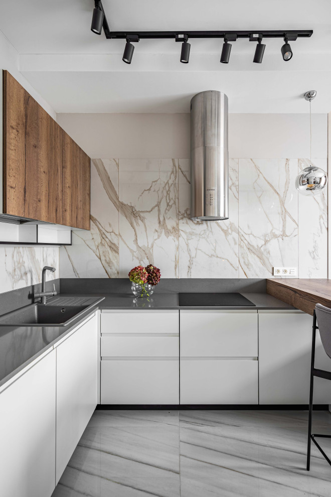 Immagine di una cucina minimal di medie dimensioni con pavimento in gres porcellanato e penisola